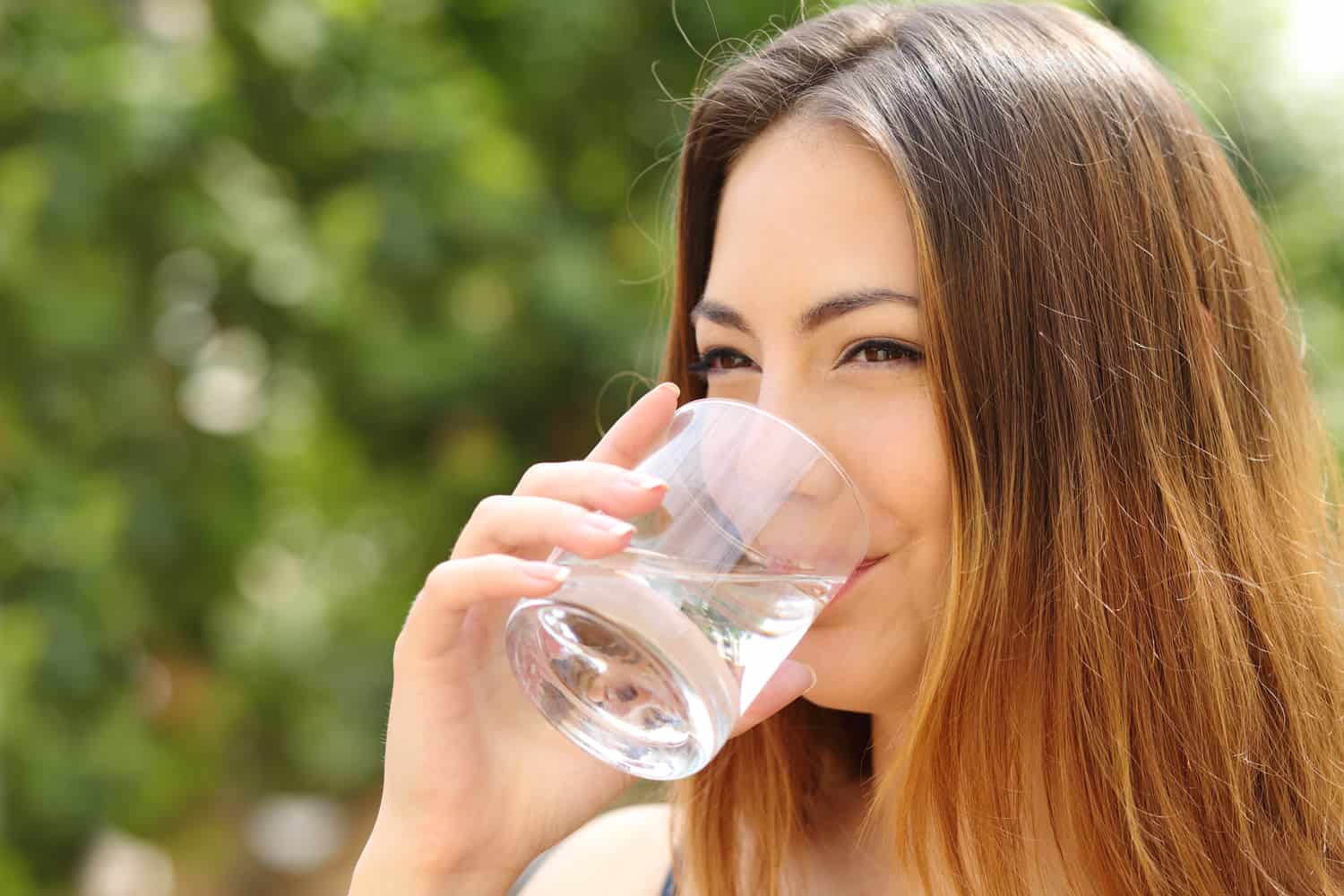 Can You Get Glowing Skin Overnight Naturally? 4 woman drinking a glass of water
