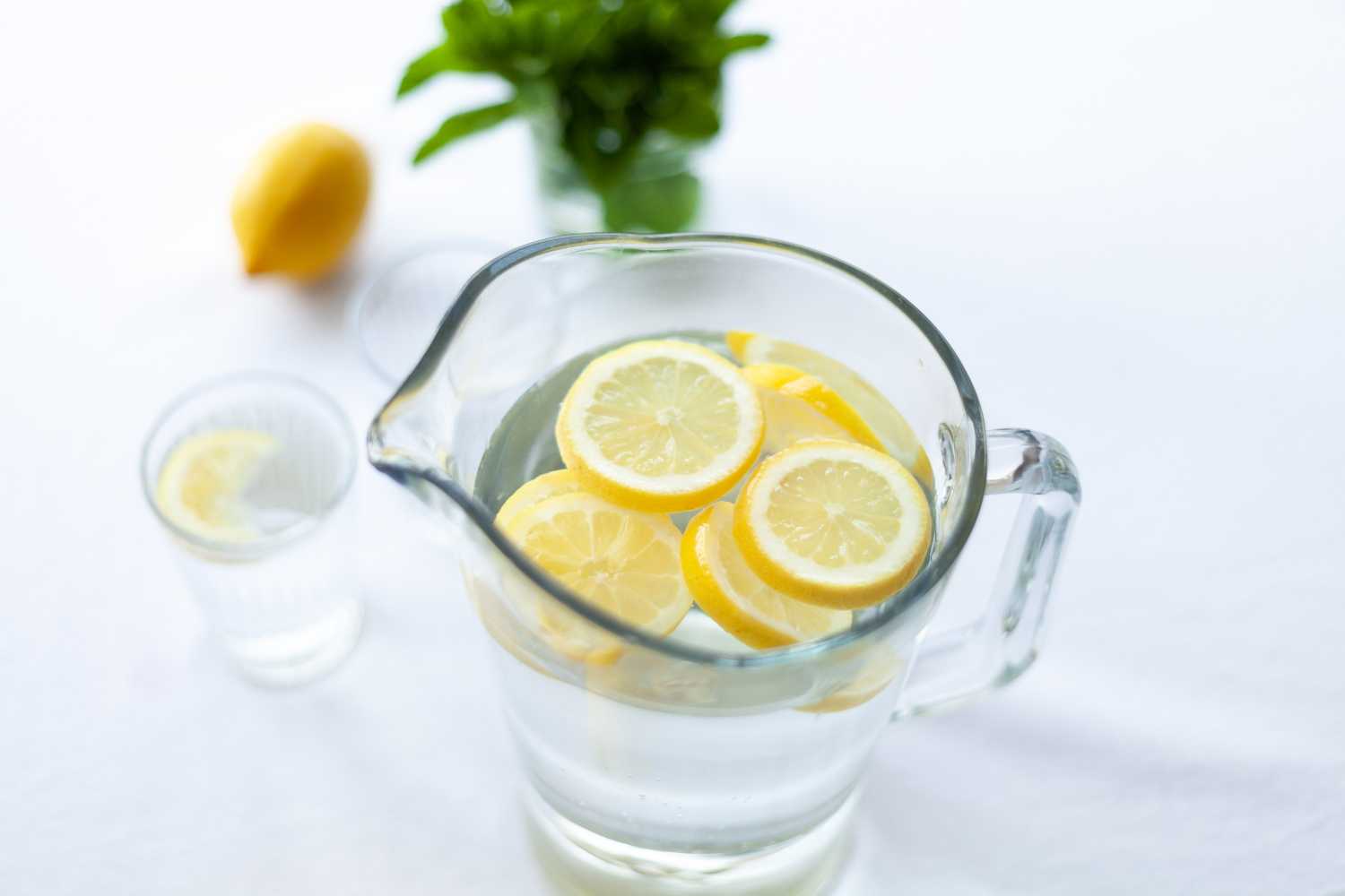 lemon water facial cleanser in a glass jug