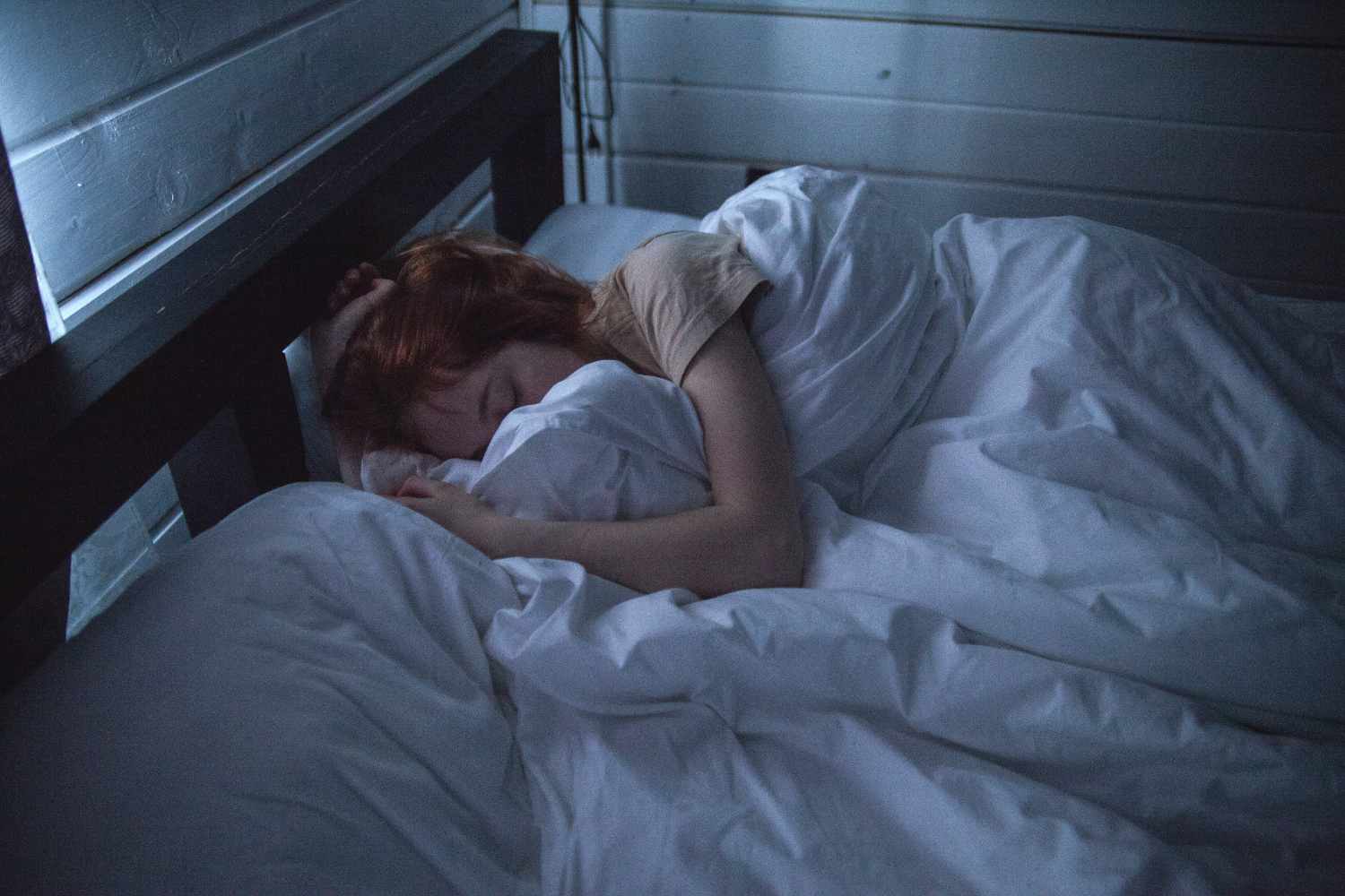 woman sleeping with white blanket
