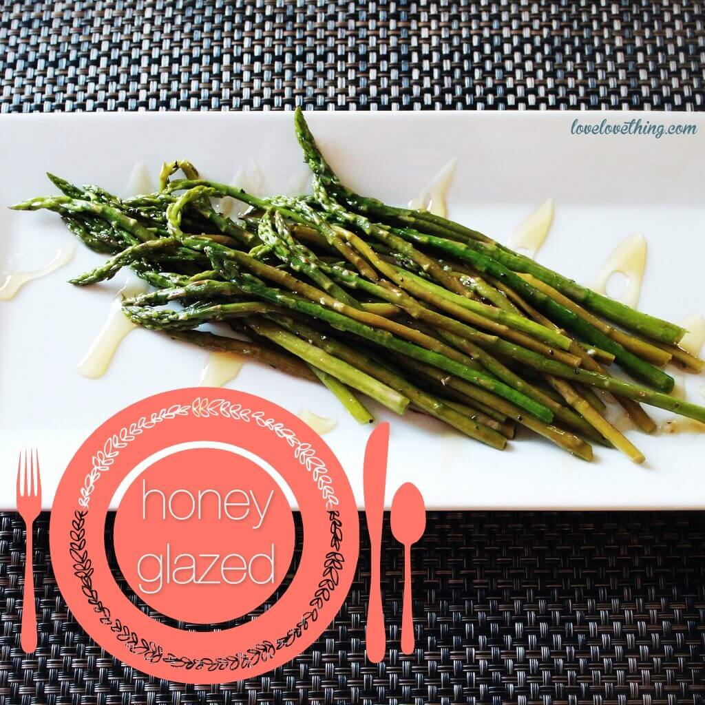 Honey-Glazed Asparagus Honey glazed asparagus on a white plate