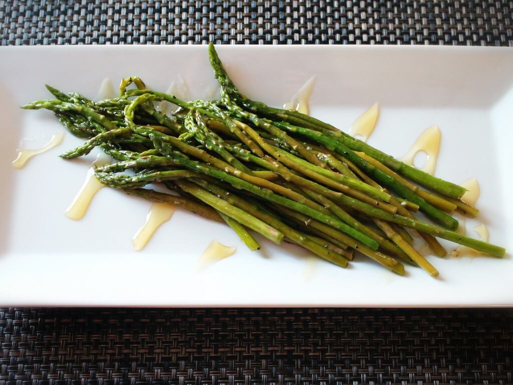 How To Cook The Best One-Pan Honey Glazed Asparagus 7 Honey glazed asparagus arranged on a white plate