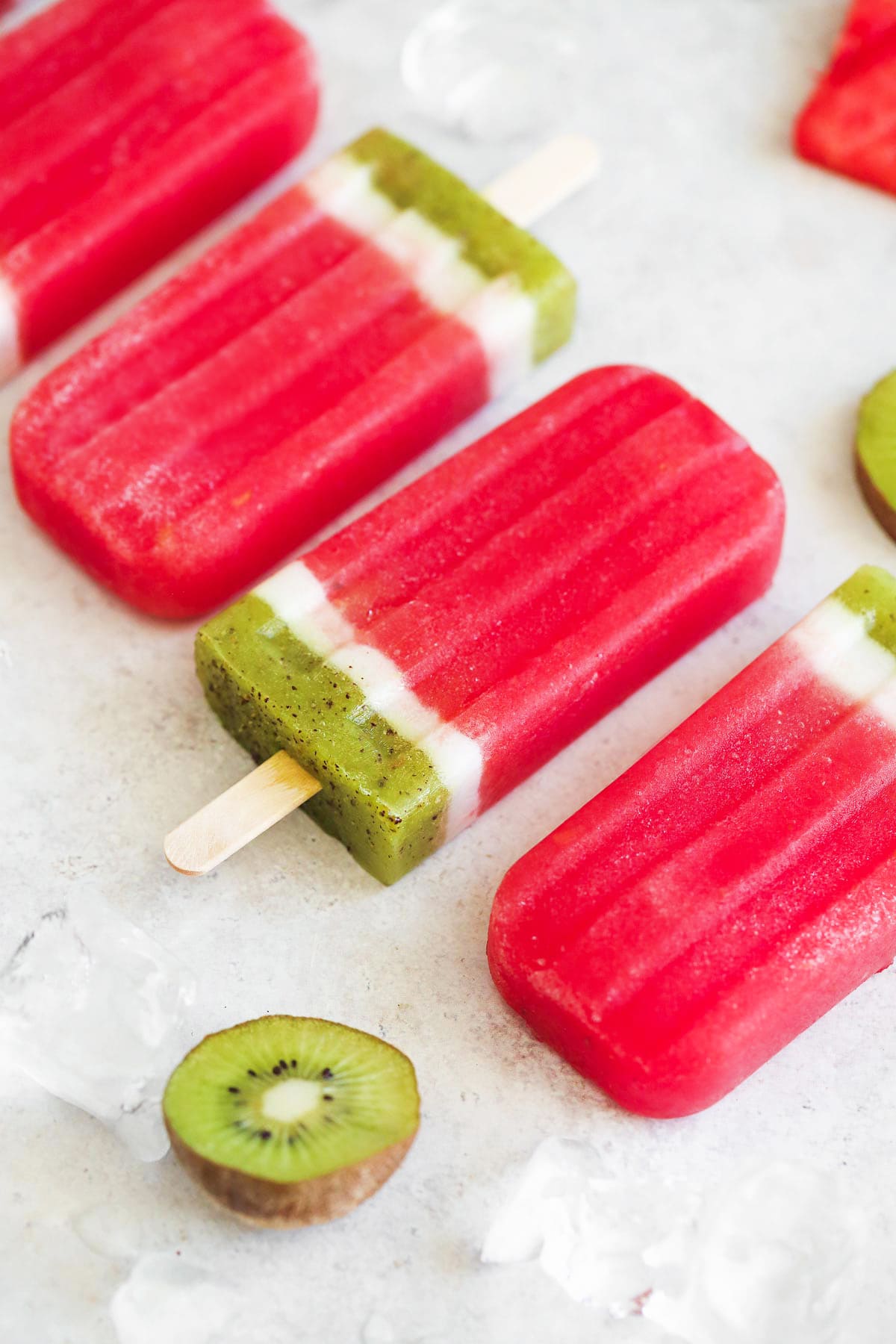 Don't Miss These Recipes Using Coconut Yogurt 6 3 coconut yogurt and watermelon popsicles lined up. The popsicles are red, white and green and look like watermelon slices.