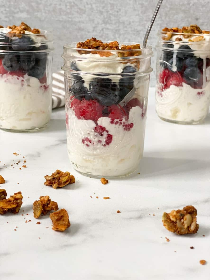 Don't Miss These Recipes Using Coconut Yogurt 4 3 Coconut Yogurt Parfaits in mason jars with granola and berries by Organically Addison