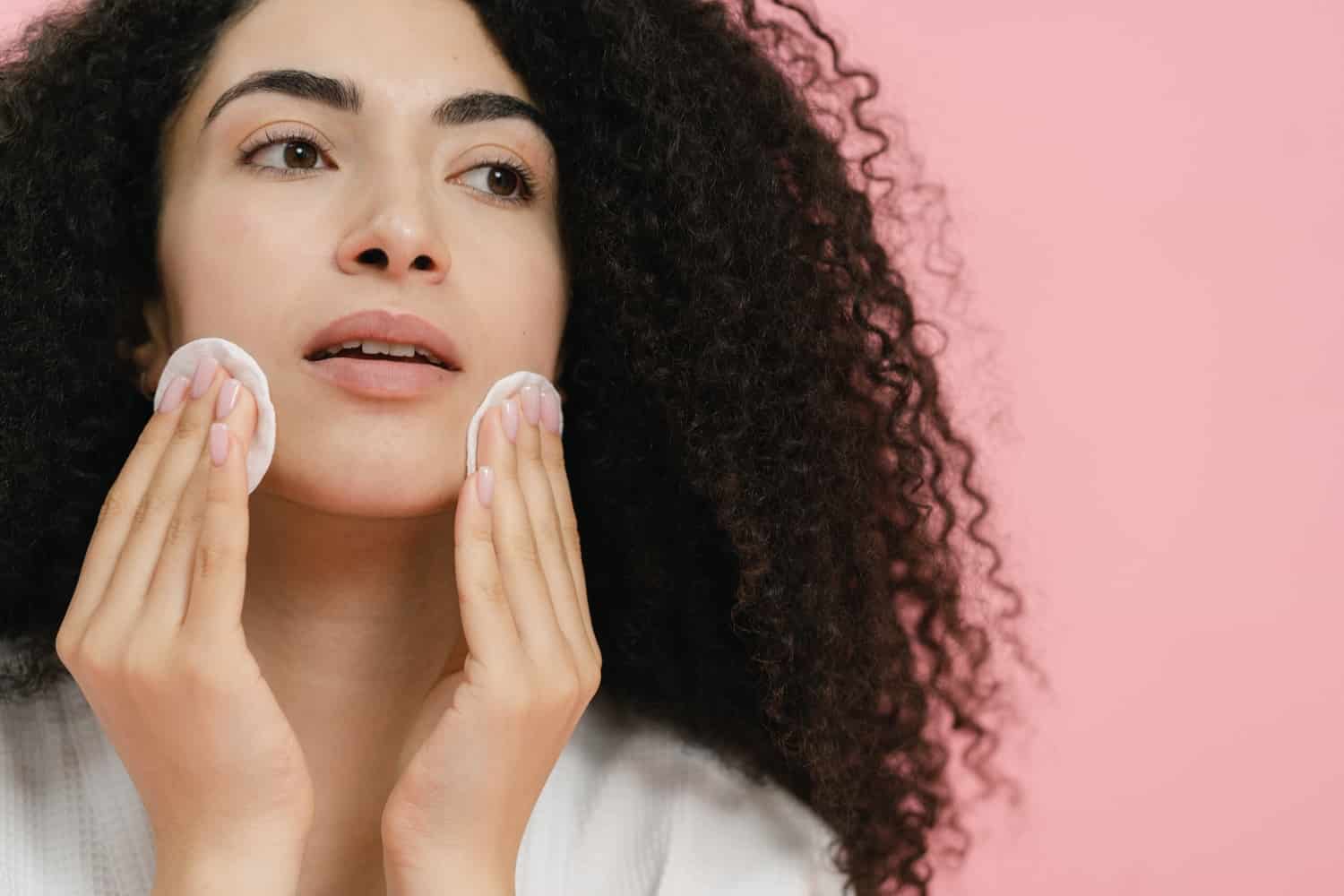 Can You Use Baby Wipes to Remove Makeup? 3 woman using makeup pads to clean her face